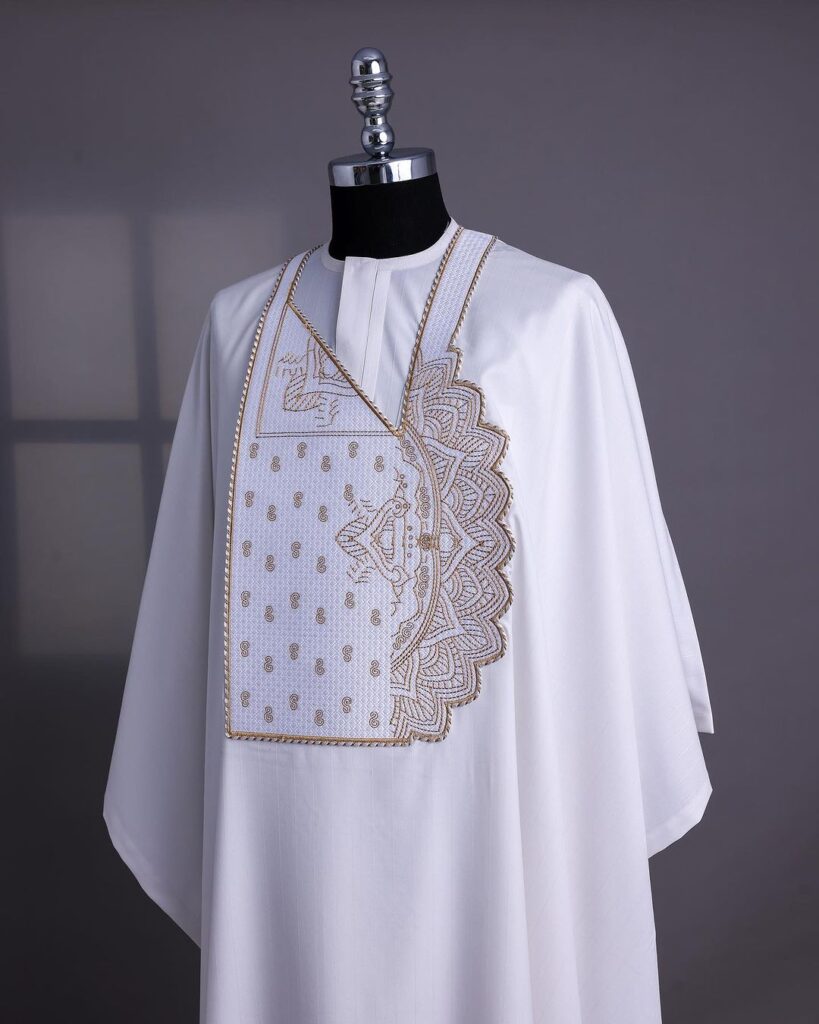 A white embroidery details agbada